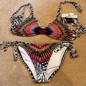 Never worn. South moon under bathing suit with beads at top. Size medium
